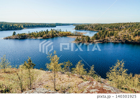 Landscape blue deep lake light sun, clouds sky mountains Ladoga skerries Karelia Landscape blue deep lake light sun, clouds sky mountains Ladoga skerries Karelia 140301925