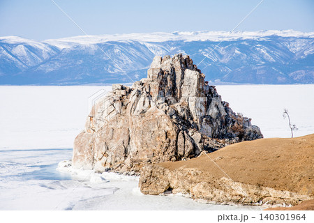 Shaman Rock on Lake Baikal Siberia Russia, winter landscape of frozen ice pond Shaman Rock on Lake Baikal Siberia Russia, winter landscape of frozen ice pond 140301964