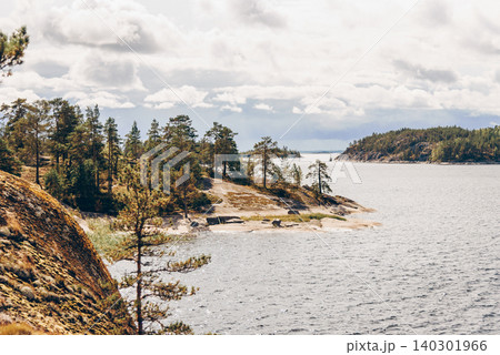 Landscape blue deep lake light sun, clouds sky mountains Ladoga skerries Karelia Landscape blue deep lake light sun, clouds sky mountains Ladoga skerries Karelia 140301966