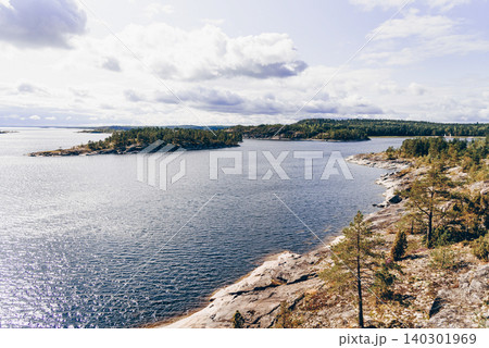 Landscape blue deep lake light sun, clouds sky mountains Ladoga skerries Karelia Landscape blue deep lake light sun, clouds sky mountains Ladoga skerries Karelia 140301969