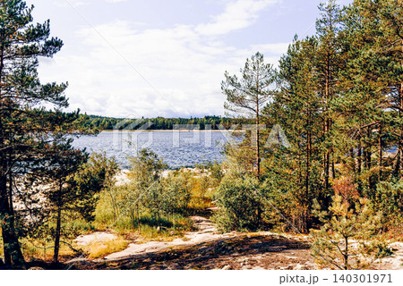 Landscape blue deep lake light sun, clouds sky mountains Ladoga skerries Karelia 140301971