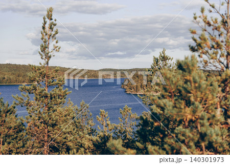 Landscape blue deep lake light sun, clouds sky mountains Ladoga skerries Karelia 140301973