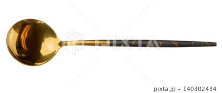 Golden metal spoon with dark patterned handle on isolated background Golden metal spoon with dark patterned handle on isolated background 140302434