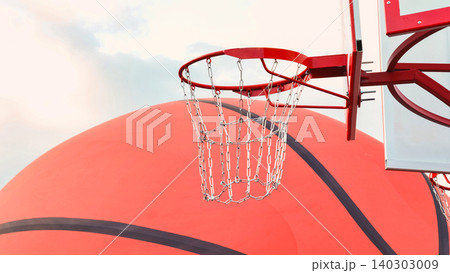 Basketball hoop and large inflatable ball under cloudy sky Basketball hoop and large inflatable ball under cloudy sky 140303009