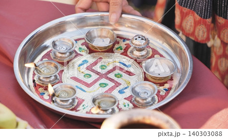 Puja thali with Ganesha festival offerings, a symbolic Hindu ritual in India Puja thali with Ganesha festival offerings, a symbolic Hindu ritual in India 140303088