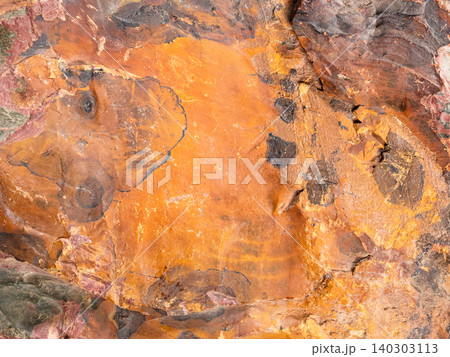 surface of rough orange brown jasper rock close-up 140303113
