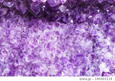 raw amethyst crystals in druse close-up raw amethyst crystals in druse close-up 140303114