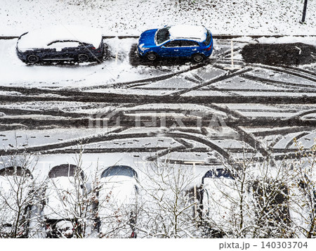above view of parking area after spring snowfall above view of parking area after spring snowfall 140303704