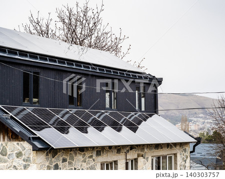 solar panels on the roof of residential building 140303757