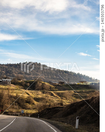 low mountains and highway in Armenia at sunset 140303796