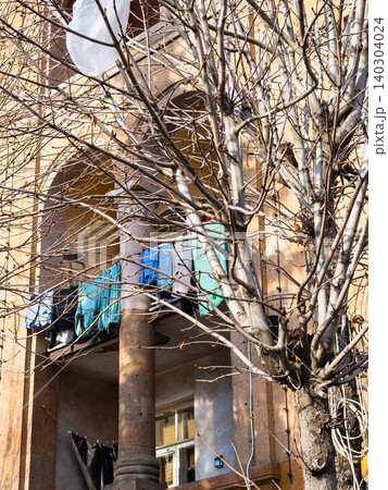 clothes drying on balcony of apartment building 140304024