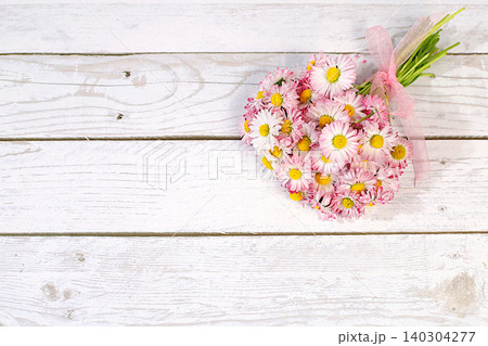 Beautiful summer banner with a bouquet of blooming daisies, a design template, and a display stand. Concept of minimalist modern aesthetics and elegant beauty. Abstract floral arrangement Beautiful summer banner with a bouquet of blooming daisies, a design template, and a display stand. Concept of minimalist modern aesthetics and elegant beauty. Abstract floral arrangement 140304277
