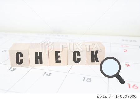 カレンダーとCHECKの文字。予定確認と虫眼鏡のビジネスイメージ。スケジュール管理 140305080