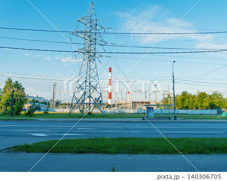 Industrial power pylon and factory skyline at roadside 140306705