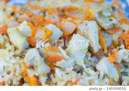 Rice pilaf with pieces of chicken, close-up Rice pilaf with pieces of chicken, close-up 140309038