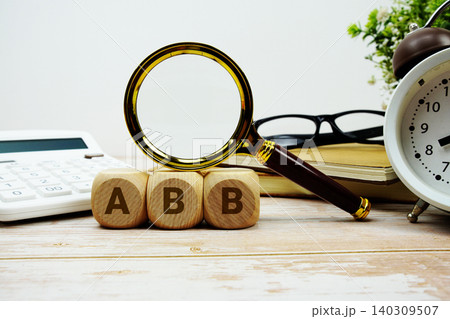 ABB Activity Based Budget alphabet letters with magnifying glass, calculator and alarm clock ABB Activity Based Budget alphabet letters with magnifying glass, calculator and alarm clock 140309507