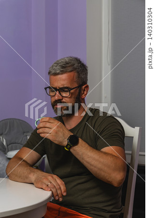 Enjoying coffee during a quiet morning break at home Enjoying coffee during a quiet morning break at home 140310304