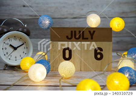 Wooden Calendar Showing the Date of July 6th. Day 6 of July month Wooden Calendar Showing the Date of July 6th. Day 6 of July month 140310729