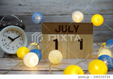 Wooden Calendar Showing the Date of July 11th. Day 11 of July month Wooden Calendar Showing the Date of July 11th. Day 11 of July month 140310734