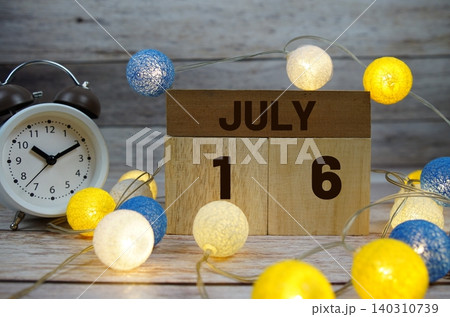 Wooden Calendar Showing the Date of July 16th. Day 16 of July month Wooden Calendar Showing the Date of July 16th. Day 16 of July month 140310739
