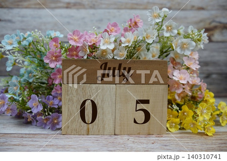 Wooden Calendar Showing the Date of July 5th. Day 5 of July month 140310741