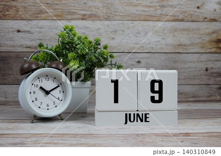 Wooden Calendar Showing the Date of June 19th. Day 19 of June Month Wooden Calendar Showing the Date of June 19th. Day 19 of June Month 140310849