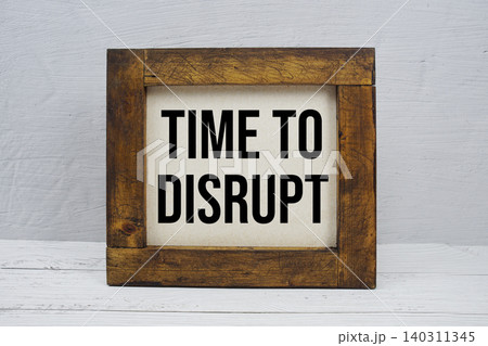 Time To Disrupt text written on wooden board Time To Disrupt text written on wooden board 140311345
