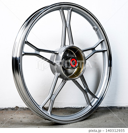 Silver motorcycle wheel rim cast alloy five spoke design in perspective view isolated on white background for motorbike custom and spare repair part Silver motorcycle wheel rim cast alloy five spoke design in perspective view isolated on white background for motorbike custom and spare repair part 140312935