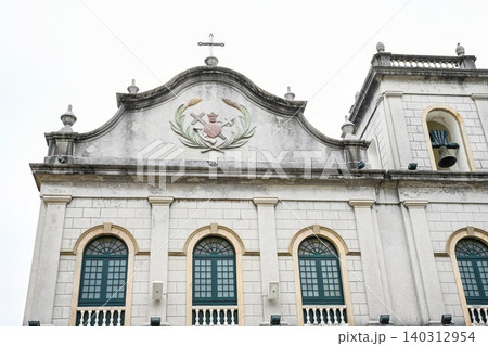 Neoclassical grey facade of historic St Lazarus Church built in 1557 and rebuilt in 1885 at street corner Neoclassical grey facade of historic St Lazarus Church built in 1557 and rebuilt in 1885 at street corner 140312954
