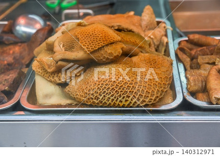 Close up of Cantonese stewed beef offal with honeycomb tripe at street food stall on famous Rua do Cunha pedestrian street in Taipa village Macau 140312971