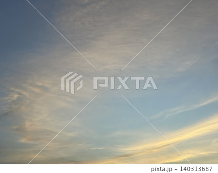 Cirrus Clouds In Blue Sky At Sunset Low Angle View Cirrus Clouds In Blue Sky At Sunset Low Angle View 140313687
