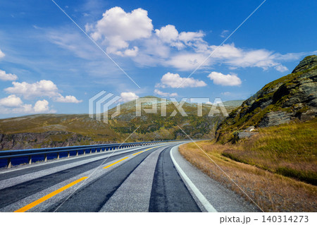A mountain road along a fjord. The nature of Norway. A mountain road along a fjord. The nature of Norway. 140314273