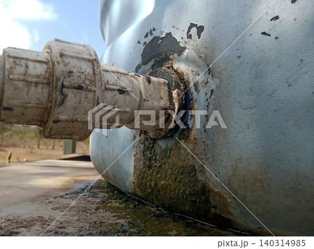 Leaking Water Tank Joint with Rusty Corrosion and Algae Buildup 140314985