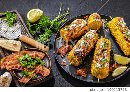 Corn elote street style is served on a plate 140315728