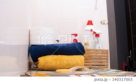 Toilet Paper, towels. Bathroom Essentials Stacked With Cleaning Supplies 140317003