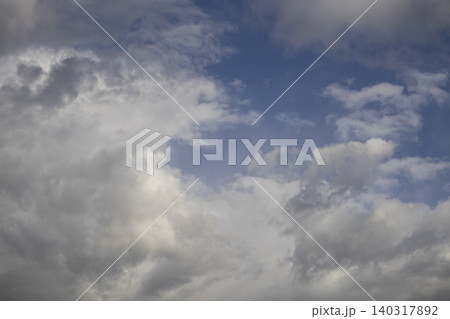 Fluffy White Clouds in Blue Sky, Beautiful Cloudscape Background. Overcast Sky with Heavy Storm Clouds, Moody Dramatic Cloudscape 140317892