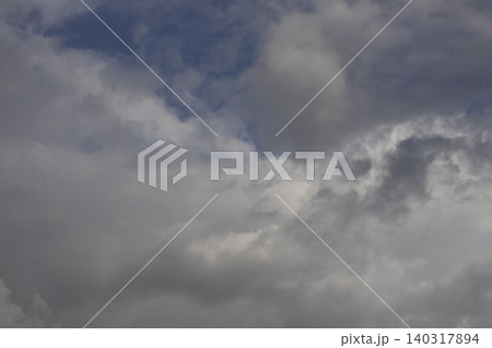 Fluffy White Clouds in Blue Sky, Beautiful Cloudscape Background. Overcast Sky with Heavy Storm Clouds, Moody Dramatic Cloudscape 140317894