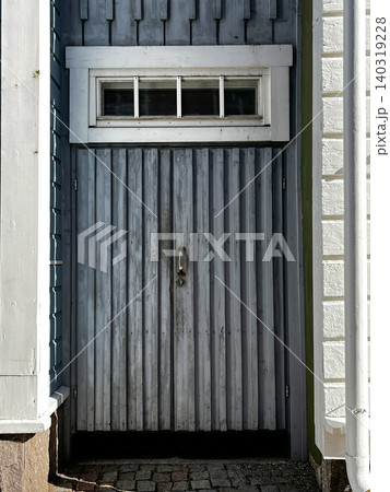 Timeworn Wooden Door of Entrance to Old House. Timeworn Wooden Door of Entrance to Old House. 140319228