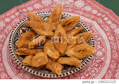 Baklava traditional pastry in bowl. Sweet diamond shapes food Baklava traditional pastry in bowl. Sweet diamond shapes food 140321125
