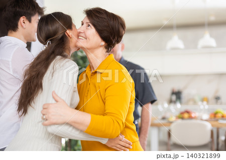 Happy parents welcome their adult son and daughter-in-law at home Happy parents welcome their adult son and daughter-in-law at home 140321899