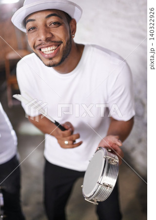 Happy, man and music on drums for carnival, festival or performance with band at party. Night, club and musician smile in portrait with instrument for playing creative samba or salsa beat with rhythm Happy, man and music on drums for carnival, festival or performance with band at party. Night, club and musician smile in portrait with instrument for playing creative samba or salsa beat with rhythm 140322926