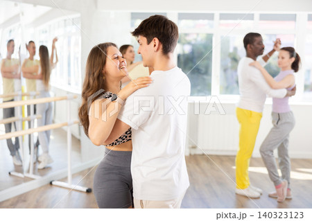 young woman and man dancing waltz young woman and man dancing waltz 140323123