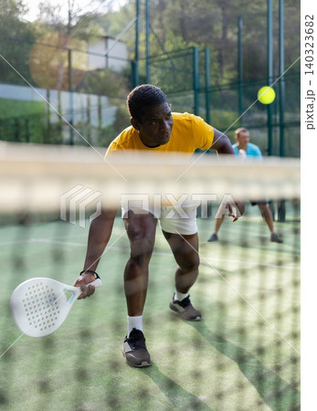 African american man playing padel tennis African american man playing padel tennis 140323682