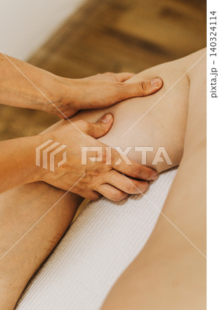 Close up of arm massage therapy session. Female massage therapist's hands. Close up of arm massage therapy session. Female massage therapist's hands. 140324114