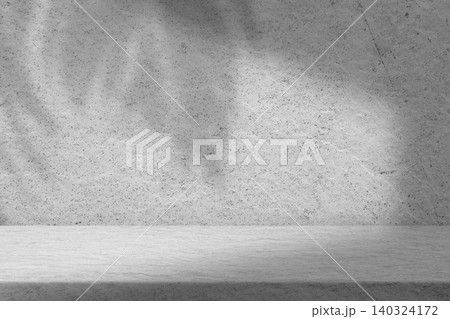 Minimalist Concrete Wall Backdrop with Soft Tropical Leaf Shadow, Clean Grey Textured Surface for Modern Interior Design and Product Presentation Minimalist Concrete Wall Backdrop with Soft Tropical Leaf Shadow, Clean Grey Textured Surface for Modern Interior Design and Product Presentation 140324172