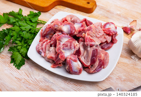Raw chicken gizzards with seasonings Raw chicken gizzards with seasonings 140324185