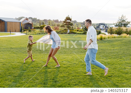 vacation, three, woman, man, child, game, day, summer, sunny, shorts, barefoot, shirt, house, camp vacation, three, woman, man, child, game, day, summer, sunny, shorts, barefoot, shirt, house, camp 140325317
