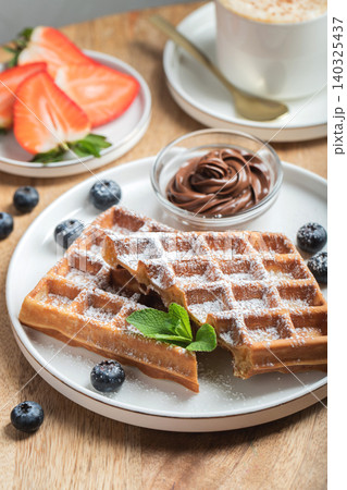 Belgium waffles Homemade waffles with strawberries Belgium waffles Homemade waffles with strawberries 140325437