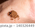 Macro photo of snuff (tobacco) on man hand. 140326449