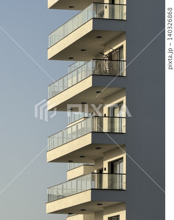 Modern architectural balconies creating abstract geometric patterns and shadows background 140326868